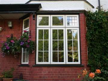 HESWALL . WIRRAL : Installation of Evolution storm window in there Tudor range. Timber windows wirral